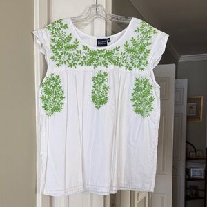 Madison Mathew’s White Blouse with Green Embroidery